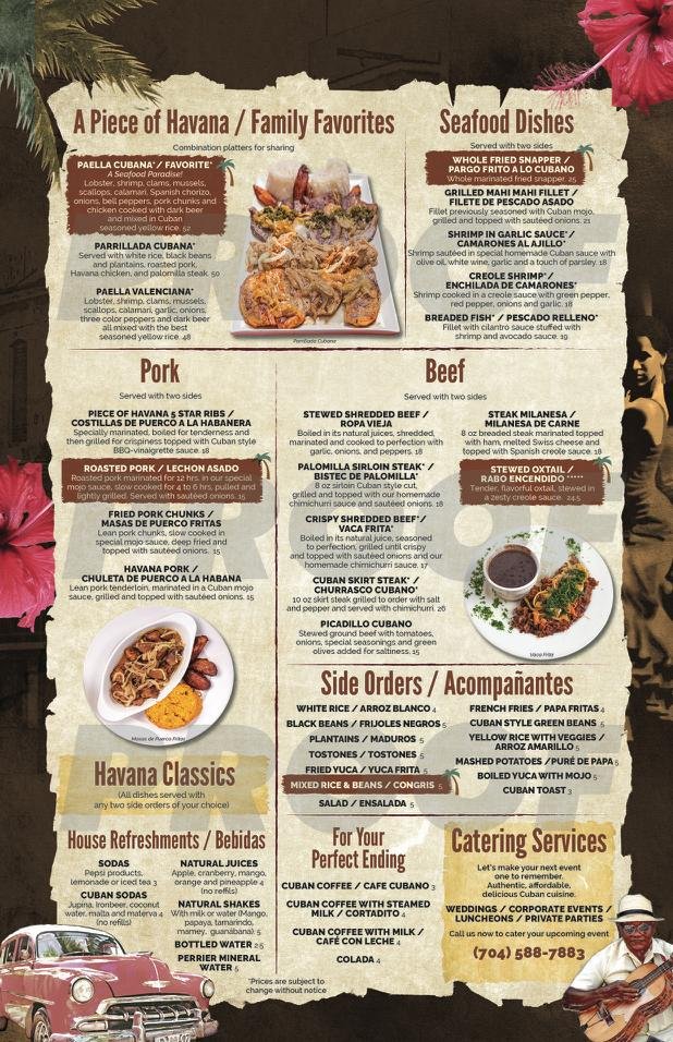 Restaurant menu beside a table setting.